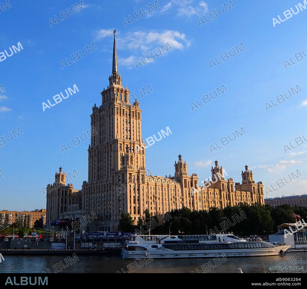 Hotel Ukraina, Moscow is a five-star luxury hotel in Moscow city centre, on a bend of the Moskva River. Hotel Ukraina was commissioned by Joseph Stalin. It was designed by Arkady Mordvinov and Vyacheslav Oltarzhevsky (leading Soviet expert on steel-framed high-rise construction), and is the second tallest of the neoclassical Stalin-era "seven sisters".