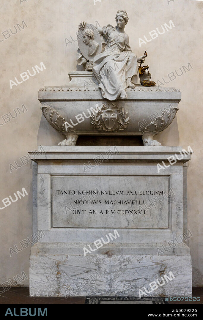 Basilica of the Holy Cross: "Monument to Niccolò Machiavelli: Philosopher, Historian, Politician", by Innocenzo Spinazzi, 1787, marble and bronze.. Above the sarcophagus there is a statue that represents a female figure which is the allegory of politics. In her right hand she holds a medallion with the portrait of Machiavelli, in the left she holds the symbols of Politics, History and Poetry. On the sarcophagus there is the family coat of arms, and on the base a Latin epigraph whose translation i is "To such a great name, no epitaph is adequate".