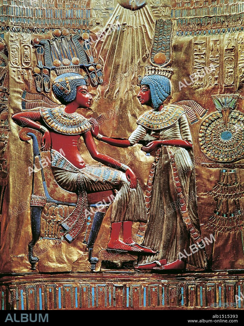 Egyptian civilization, New Kingdom, Dynasty XVIII. Treasure of Tutankhamen. Throne made of wood, gold leaf, silver, semiprecious stones and vitreous pastes. On the back, figures of Tutankhamen and his wife Ankhesenamon protected by solar disc. H. 102 cm. Detail: the back of the throne.