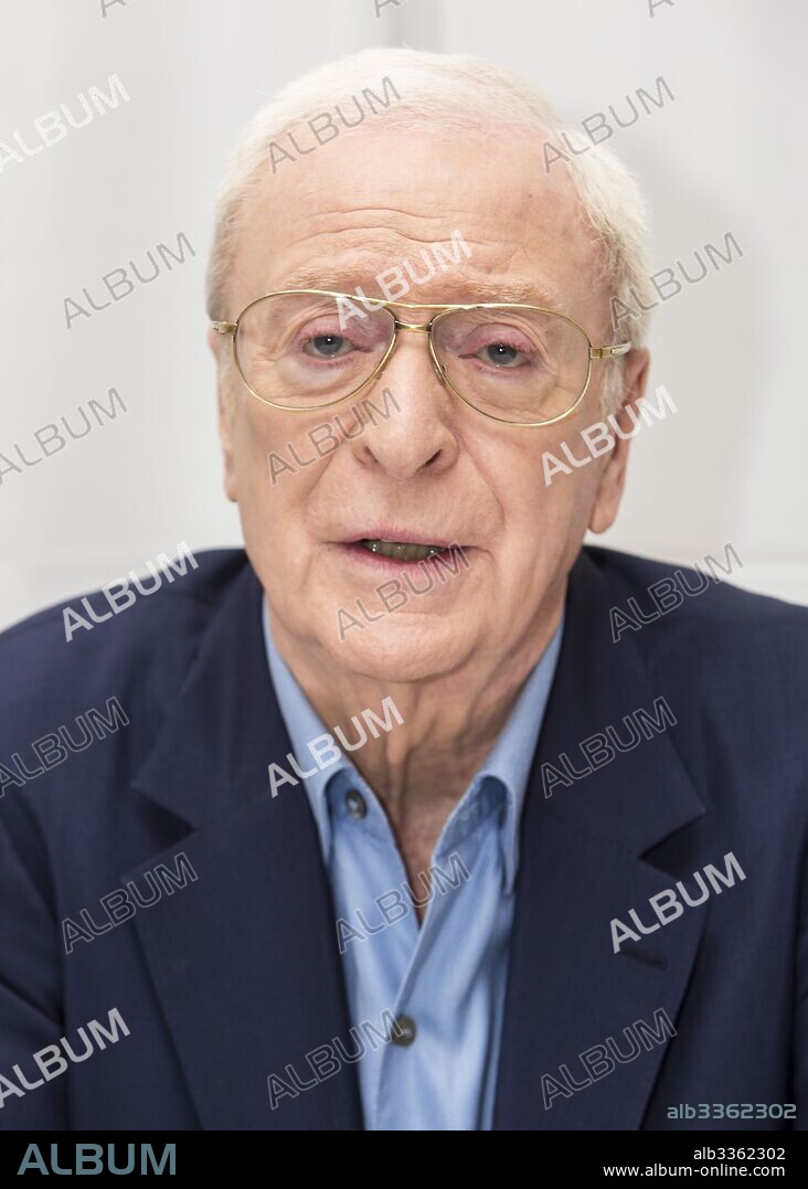 MICHAEL CAINE. March 25, 2017 - New York, New York, U.S. - MICHAEL CAINE promotes 'Going in Style'. Sir Michael Caine, CBE (born Maurice Joseph Micklewhite; March 14 1933) is an English actor and author. Renowned for his distinctive working class cockney accent, Caine has appeared in over 115 films and is regarded as a British film icon. He made his breakthrough in the 1960s with Zulu (1964), The Ipcress File (1965), Alfie (1966), for which he was nominated for an Academy Award, The Italian Job (1969), and Battle of Britain (1969). His most notable roles in the 1970s included Get Carter (1971), The Last Valley, Sleuth (1972), for which he earned his second Academy Award nomination, The Man Who Would Be King (1975), and A Bridge Too Far (1977). He achieved some of his greatest critical success in the 1980s, with Educating Rita (1983) earning him the BAFTA and Golden Globe Award for Best Actor. In 1986, he received an Academy Award for Best Supporting Actor for his performance in Woody Allen's Hannah and Her Sisters. Caine played Ebenezer Scrooge in The Muppet Christmas Carol (1992). Having by that time practically retired from acting on the big screen, he enjoyed a career resurgence in the late 1990s, receiving his second Golden Globe Award for his performance in Little Voice in 1998 and receiving his second Academy Award for Best Supporting Actor for The Cider House Rules the following year. Caine played Nigel Powers in the 2002 parody Austin Powers in Goldmember, and Alfred Pennyworth in The Dark Knight Trilogy. He appeared in several other of Nolan's films including The Prestige (2006), Inception (2010), and Interstellar (2014). He also appeared as a supporting character in Children of Men and Pixar's 2011 film Cars 2. As of February 2017, films in which he has starred have grossed over 3.5 billion domestically and over 7.8 billion worldwide. Caine is ranked the eleventh highest grossing box office star. Caine is one of only two actors nominated for an Academy Award for acting i. 25/03/2017