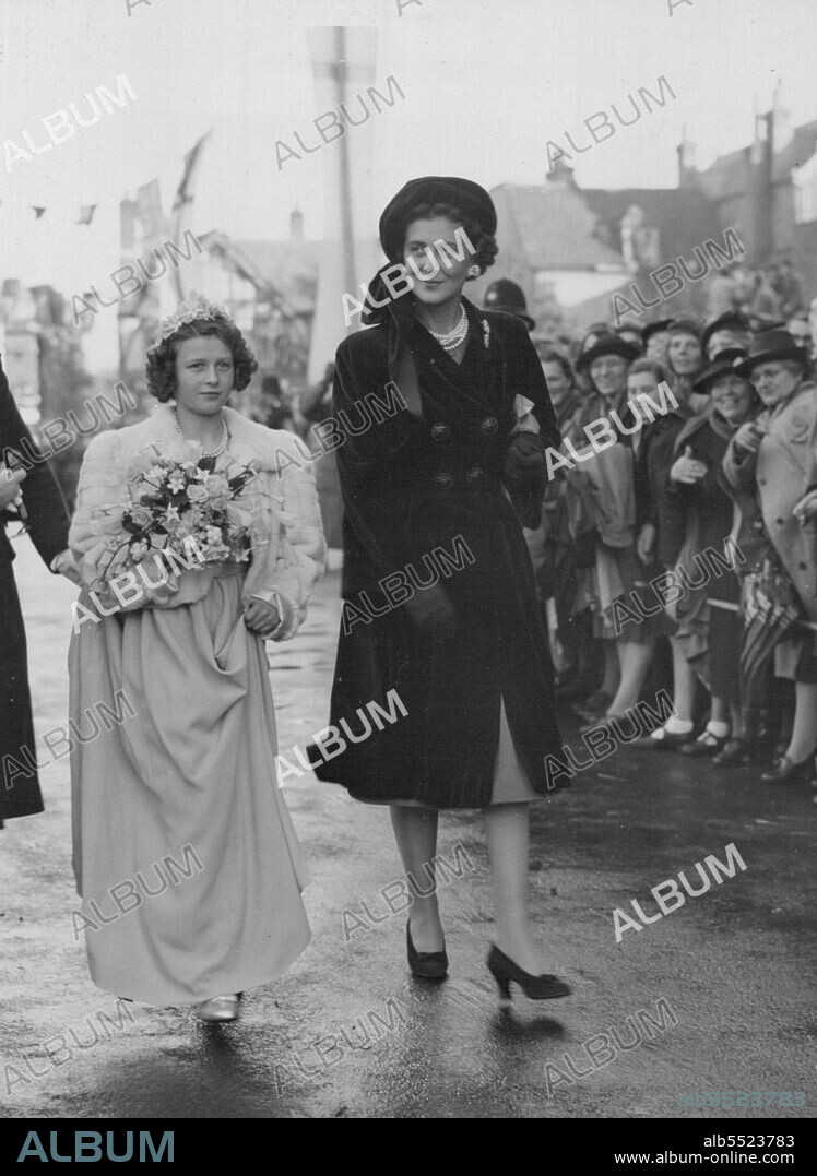 Mountbatten Wedding -- The Duchess of Kent is seen arriving with her daughter Princess Alexandra who was one of the Bridesmaids - for the wedding of the Hon. Patricia Mountbatten and Capt. The Lord Brabourne at Romsey Abbey, Hampshire, today October 26. November 05, 1946. (Photo by Associated Press Photo).