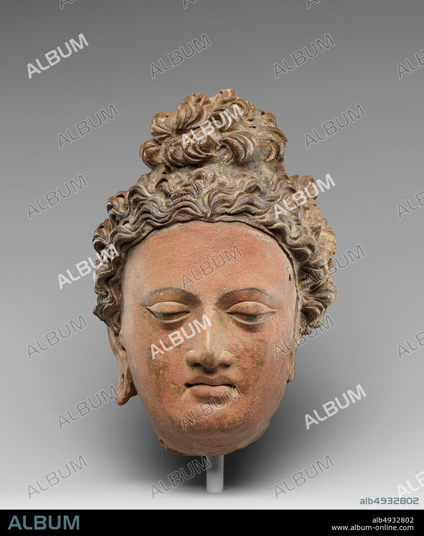 Head of a Buddha, Pakistan (ancient region of Gandhara) or Afghanistan, 3rd4th century, Pakistan (ancient region of Gandhara) or Afghanistan, Clay with pigments, H. 10 1/2 in. (26.7 cm); W. 7 1/2 in. (19.1 cm), Sculpture.