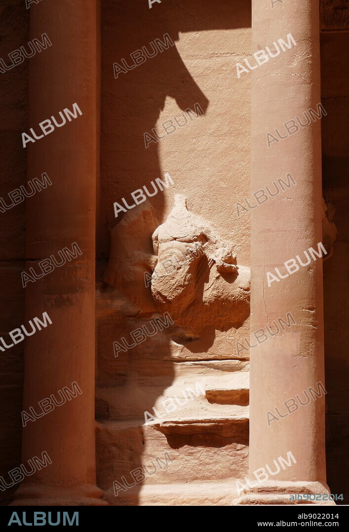 Al-Khazneh (The Treasury) a temple in the ancient Nabatean Kingdom city of Petra, Jordan. The structure was carved out of a sandstone rock face and is believed to have been the mausoleum of the Nabatean King Aretas IV in the 1st century AD. It is one of the most popular tourist attractions in both Jordan and the region. In 1812, the city of Petra and Al-Khazneh was rediscovered by Swiss explorer Johann Ludwig Burckhardt.