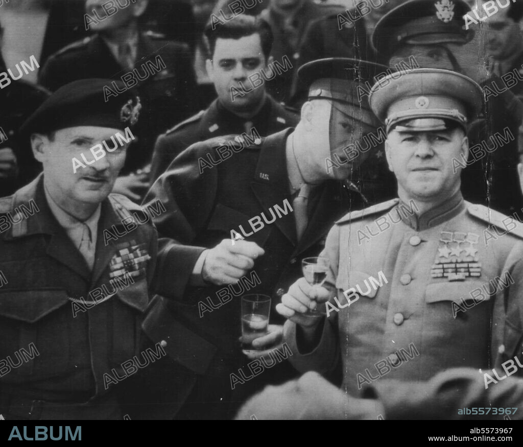 British Field Marshal Sir Bernard L. Montgomery, Gen. Dwight D. Eisenhower and Russian Marshal Georgi K. Zhukov (left to right) toast European victory of United Nations at Frankfurt on Main, June 10, when Zhukov Presented Russian Order of Victory to Montgomery and Eisenhower. June 16, 1945. (Photo by British Official Photo).