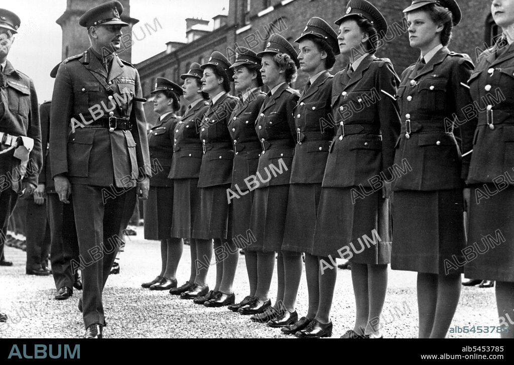 Redcaps Become Royal Corps. - The Duke of Gloucester inspecting the ATS Provost Company.The Duke of Gloucester inspected and took the salute at a march-past of Royal Military Police yesterday at Inkerman Barracks, Working. The Special Investigating Branch ***** The amount in 1945/6 alone was £6,000000. The Roll of Honour would bear nearly 1000 names of members of the Corps who lost their lives. The King has shown his appreciation of their record by granting them the distinction of becoming the Coprs of "Royal" Military Police. August 5, 1947.