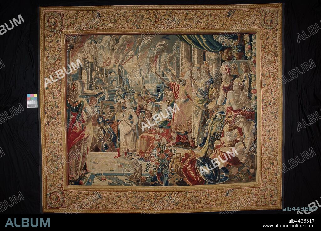 Brand van Persepolis from the series History of Alexander the Great, In the midfield in front of a number of columns and under a canopy, stands Alexander the Great. He is surrounded by a number of women and servants and points to the burning palace complex in Persepolis that is shown on the left of the back plan. In the front left, a woman with her back to the viewer watches the whole thing. At the center of the foreground are a shield, crockery, a vase of flowers and a monkey. The broad border is decorated with vines and finely worked out fluttering birds in different colors, Alexander the Great, Karel van Mander (II) (signed by artist), Delft, 1619, ketting, inslag, tapestry, h 438 cm × w 513 cm.