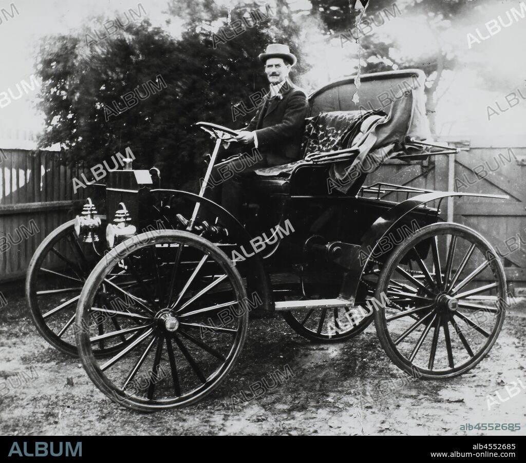 Photograph - Mr Thomas M. Arthur Driving a Schacht Motor Buggy, Melbourne, Victoria, circa 1908-1909, Black and white photograph of a man driving a motor buggy. It is part of a collection of photographs, negatives and slides used for research by curators at Museum Victoria.