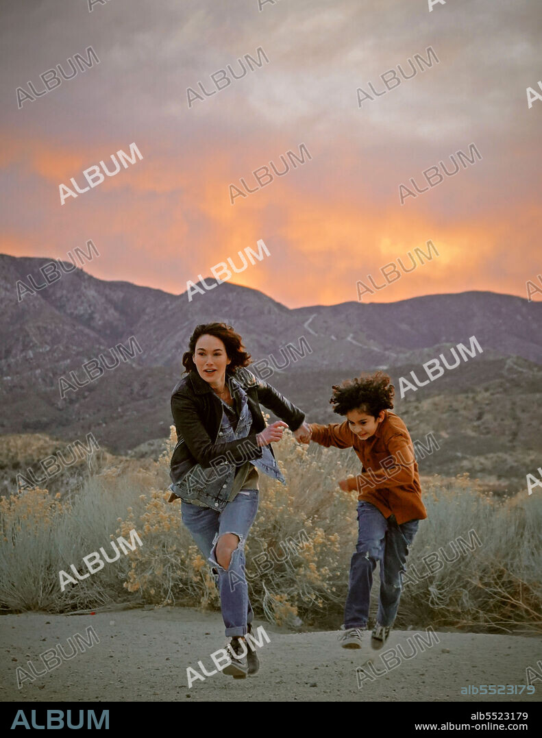 DEAN SCOTT VAZQUEZ and LENA HEADEY in 9 BULLETS, 2022, directed by GIGI GASTON. Copyright Screen Media Films.