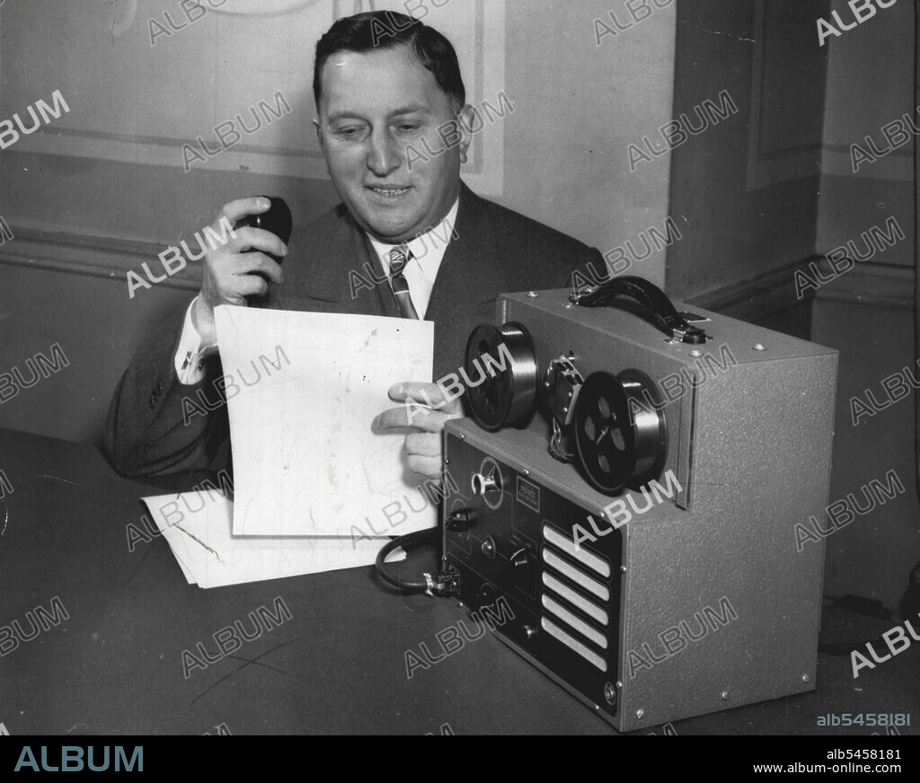 Electronics Helps Executive -- The wire-recorder, a wartime development, has been tailored for use as an office dictation machine. There are several microphone types of the device available, equipped with foot controls and headset for use by secretaries. Voice sounds - like telephone conversations, conference proceedings, news reporting - can be recorded by the device. The machine is now in production and has a market price of $400. Here Charles P. Peirce, President of the Peirce Magnetic Wire Recorder Corp., Evanston, Ill., demonstrates how the machine is used for dictating letters. January 14, 1947. (Photo by Wide World Photos).