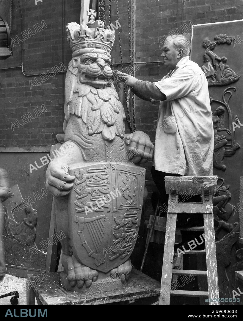 THE QUEEN'S BEASTS FOR ABBEY ANNEXE. Mr James Woodford, RA, at work in his studio in Hammersmith today on the model of the Lion of England which will stand guard at the Royal entrance to the Annexe of Westminster Abbey for the Coronation. It is one of the ten Queen's Beasts taken from the hereldic devices used by the Her Majesty's ancestors, and which will form part of the decorative scheme of the Coronation Annexe to Westminster Abbey. The lion wears the authentic expression of that "ferocious loyalty". 6 February 1953.