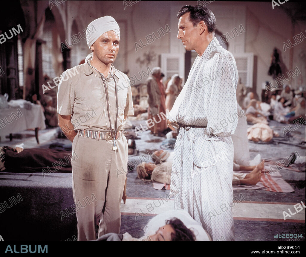 MICHAEL RENNIE and RICHARD BURTON in THE RAINS OF RANCHIPUR, 1955, directed by JEAN NEGULESCO. Copyright 20TH CENTURY FOX.