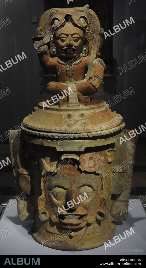 Funerary urn with depiction of the solar god Kinich Ahau and the image of the deceased on the cover. Painted ceramic. Maya culture. Late Classic Period (600-900 AD). Mesoamerica. Maya area. Museum of the Americas. Madrid, Spain.