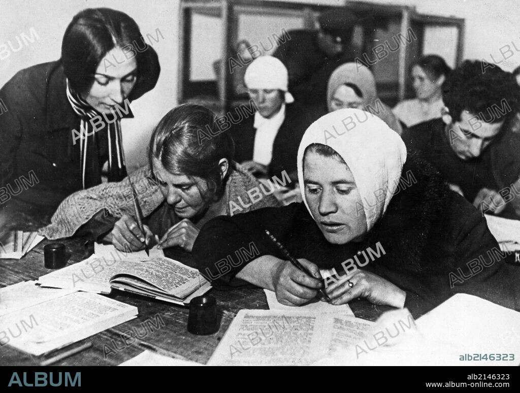 Soviet women being taught to read and write during a literacy drive in the early 1930s, ussr.