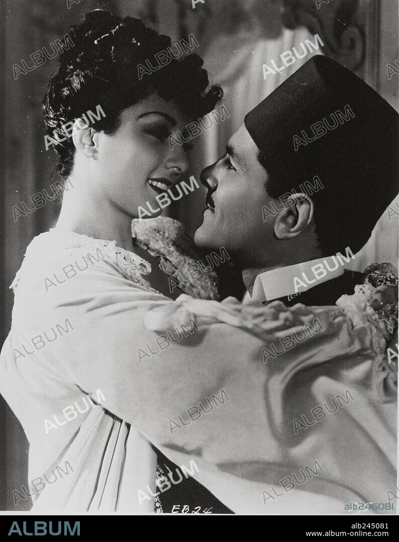 JOHN LODGE y VIVIANE ROMANCE en LA ESCLAVA BLANCA, 1939 (L' ESCLAVE BLANCHE), dirigida por MARC SORKIN. Copyright LUCIA FILM.