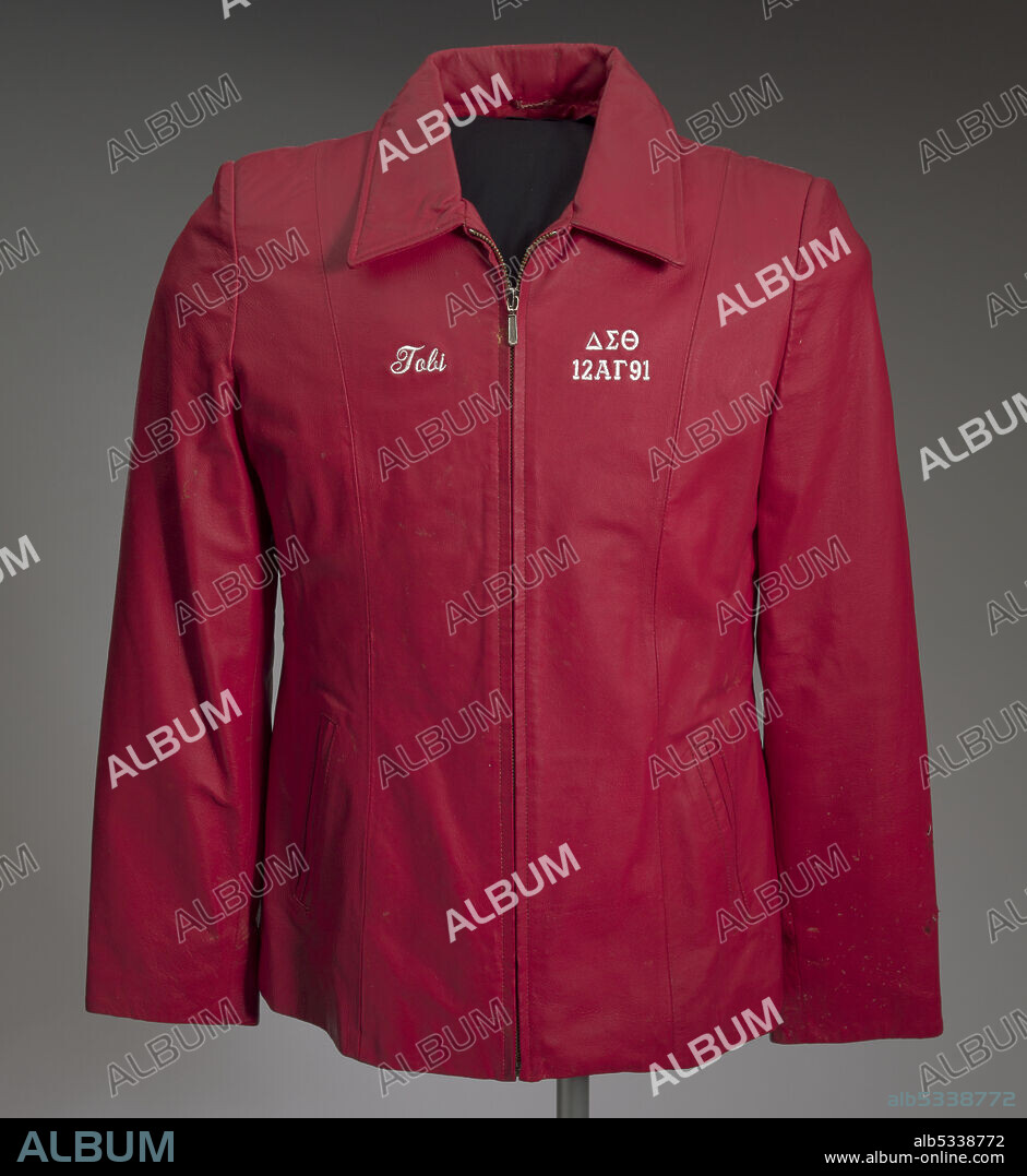 Delta Sigma Theta Sorority, a historically African-American sorority, was founded in 1913 by twenty-two women at Howard University in Washington, D.C. The jacket is constructed of dyed red leather shell and polyester lining. There s a large collar and a zipper down the front. There is white embroidered on the chest of the jacket. On the PR side it reads [Tobi] in script. On the PL breast it reads [??T / 12?G91]. There are two exterior pockets on either side of the waist. At the back of the collar is an embroidered white tag reading [LA-ROSE / L].