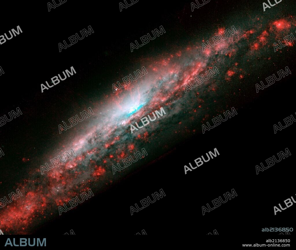 Galaxy NGC 3079, located 50 million light-years from Earth in the constellation Ursa Major, has a huge bubble of gas in the center of its disc. Hubble Space Telescope (HST).  (Photo by: Universal History Archive/UIG via Getty Images).