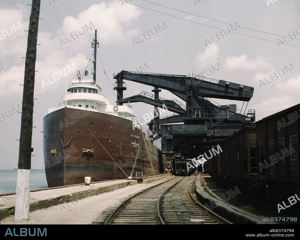 JACK DELANO. Pennsylvania R.R. ore docks, unloading ore from a lake freighter by means of "Hulett" unloaders, Cleveland, Ohio.