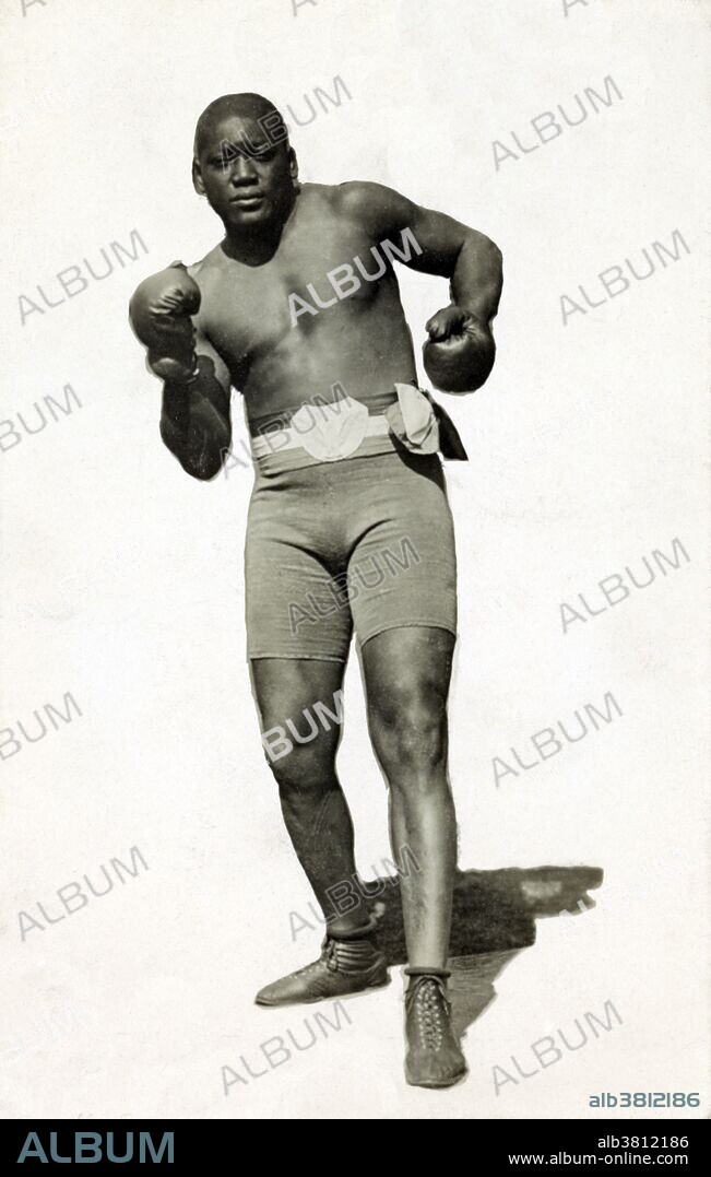 Wagner and Caywood postcard of Johnson wearing boxing shorts and boxing gloves, 1910. John Arthur "Jack" Johnson (March 31, 1878 - June 10, 1946) was the first African-American world heavyweight boxing champion (1908-15). He had a unique fighting style, which was not customary to boxing during this time. He would fight defensively, waiting for his opponents to tire out. He would continuously dodge their punches, and quickly strike back with a blow of his own. He often made his fights look effortless, but when pushed he could also display some powerful moves, and punches. He was an early example of the celebrity athlete in the modern era, appearing regularly in the press and later on radio and in motion pictures. On June 10, 1946, he died in a car crash after racing angrily from a diner that refused to serve him. He was 68 years old. During his boxing career, he fought 114 fights, winning 80 matches, 45 by knockouts. He was inducted into the Boxing Hall of Fame in 1954, and is on the roster of both the International Boxing Hall of Fame and the World Boxing Hall of Fame.