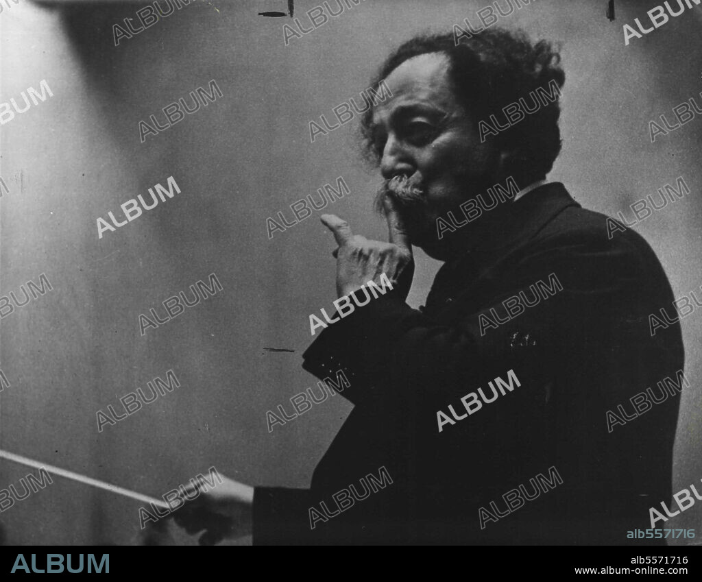 Camera in The Strings -- Pierre Monteaux uses a gentle that needs no explanation, as Siegel portrays him. September 30, 1949. (Photo by Adrian Siegel, Pictorial Press).