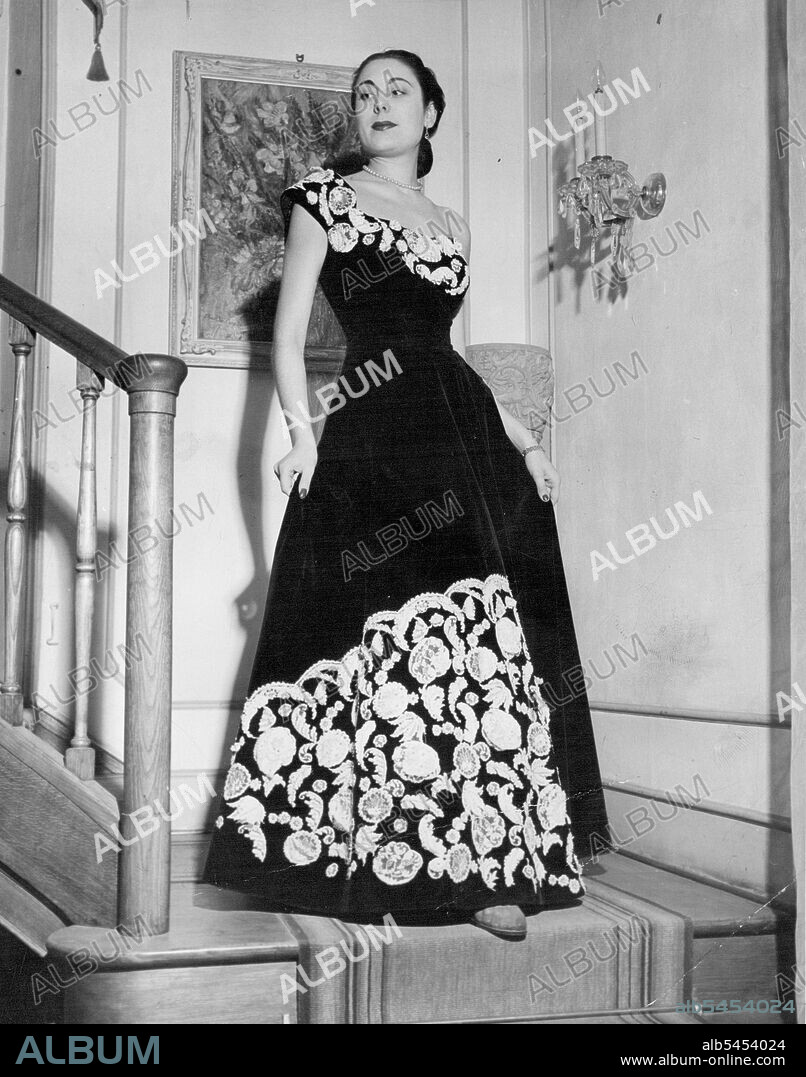 Another typically Fontana model - black silk velvet, ***** appliqued with fine white lace, embroidered with tiny pearls. 
A typical Fontana model - black silk velvet appliqued with lace. Winner and friend will attend an Italian fashion show. June 15, 1949.