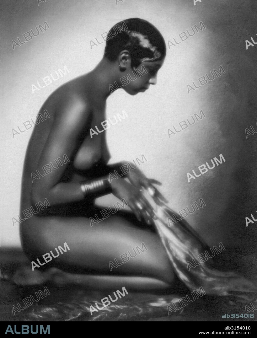 Paris, France:  c. 1928. Side profile of a kneeling nude Josephine Baker.
