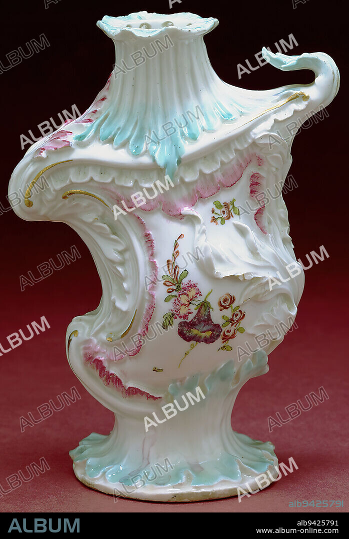 Vase, c. 175869, Derby Porcelain Factory, Derby, England, c. 17481848, 8 x 5 3/4 x 3 1/8 in. (20.32 x 14.61 x 7.94 cm), Painted and gilded porcelain, England, 18th century, With vases such as this, English potteries copied the height of French Rococo styleso called because the ornament suggests broken shells or rockwork (rocaille in French). In the most extreme examples, the decoration dictated the vessels shape. You can see that happening here. Constructed from molded leaf forms that sweep up and down, the asymmetrical vase seems almost to be moving or swaying in the breeze.