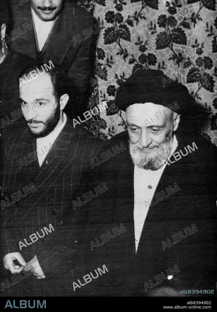 Razmara's Assassin Freed.Khalil Tahmasebi (left), confessed assassin of the Prime Minister of Persian, General Razmara, calls on Iran's religious leader, Ayatollah Kashani (right), in Tehran, after his release from prison, November 15.Tahmasebi, who had been in prison since Mid-March, 1951, when General Razmara was shot, was released under the special Bill passed by the Majlis three months ago and endorsed by the Shah last week. November 19, 1952. (Photo by Associated Press Photo).