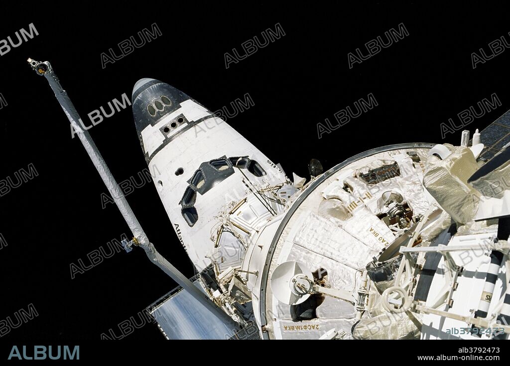 The cabin of the Space Shuttle Atlantis, its remote manipulator system (RMS) arm in operational mode, as well as part of the International Space Station are included in the 35mm frame. Cosmonaut Malenchenko, representing the Russian Aviation and Space Agency, and Astronaut Lu performed a busy space walk in excess of six hours as part of the effort to ready the station for its soon-to-arrive inhabitants. The spacewalk's objective focused on routing and connecting nine power, data and communications cables between the Zvezda module and the other Russian-built module, Zarya, as well as installing the six-foot-long magnetometer. The magnetometer will serve as a three-dimensional compass designed to minimize Zvezda propellant usage by relaying information to the module's computers regarding its orientation relative to the Earth. STS-106 was a Space Shuttle mission to the International Space Station (ISS) flown by Space Shuttle Atlantis. Atlantis launched September 8 and landed September 19, 2000.