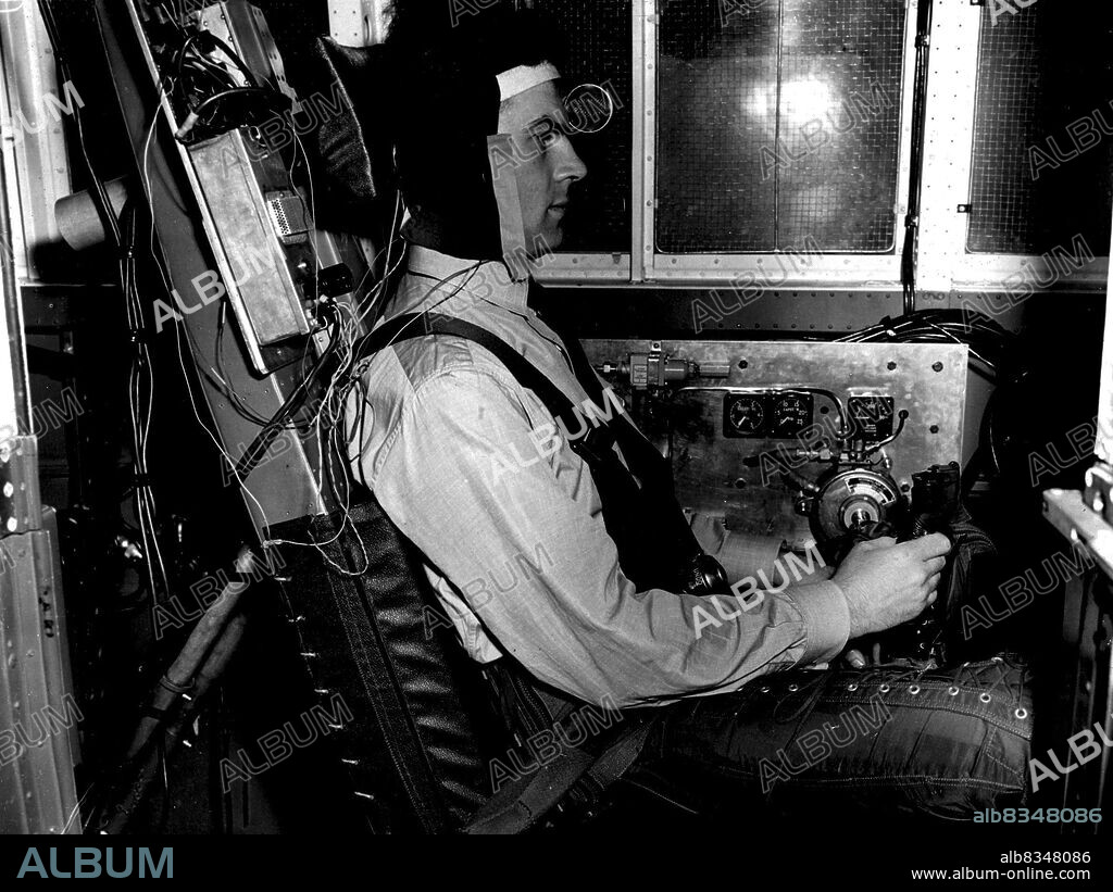 R.A.F. Demonstrate Man-Carrying Centrifuge - The Man-Carrying Centrifuge at the R.A.F. Institute of Aviation Medicine, Farnborough, is a piece of apparatus capable of simulating the centrifugal acceleration encountered by pilots when they change direction at high speed. This can result in various physiological effects, even causing unconsciousness. The apparatus consists of a 60-ft rotating arm, pivoted in the centre, at each end of which is a car weighing 1,150 lbs. These cars can attain a speed of more than 115 mph, and at this speed the centrifugal force on the cars is equivalent to 30g - or a force equal to 30 times that of gravity. May 17, 1955.