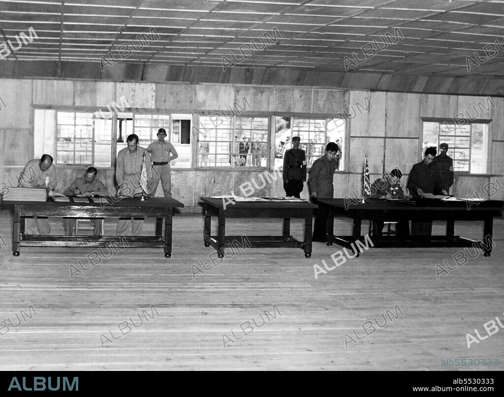 General William K. Harrison, Jr., seated at left, and North Korean General Nam Il, seated at right, sign armistice documents in Armistice Hall in Panmunjom, a no-man's-land between the Koreas. The 1953 Korean armistice agreement did stop the fighting, but no final peace treaty was signed.