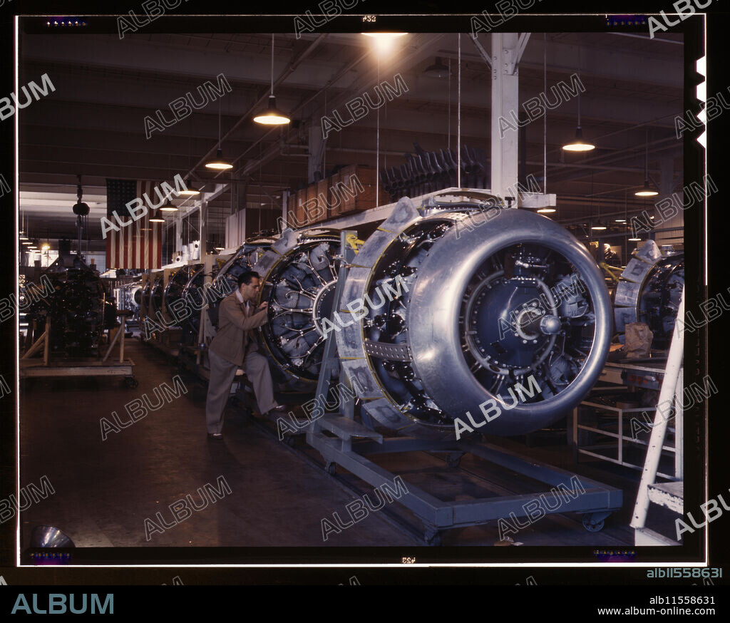 ALFRED T PALMER. Cowling and control rods are added to motors for North American B-25 bombers as they move down the assembly line, North American Aviation, Inc., Inglewood, Calif.