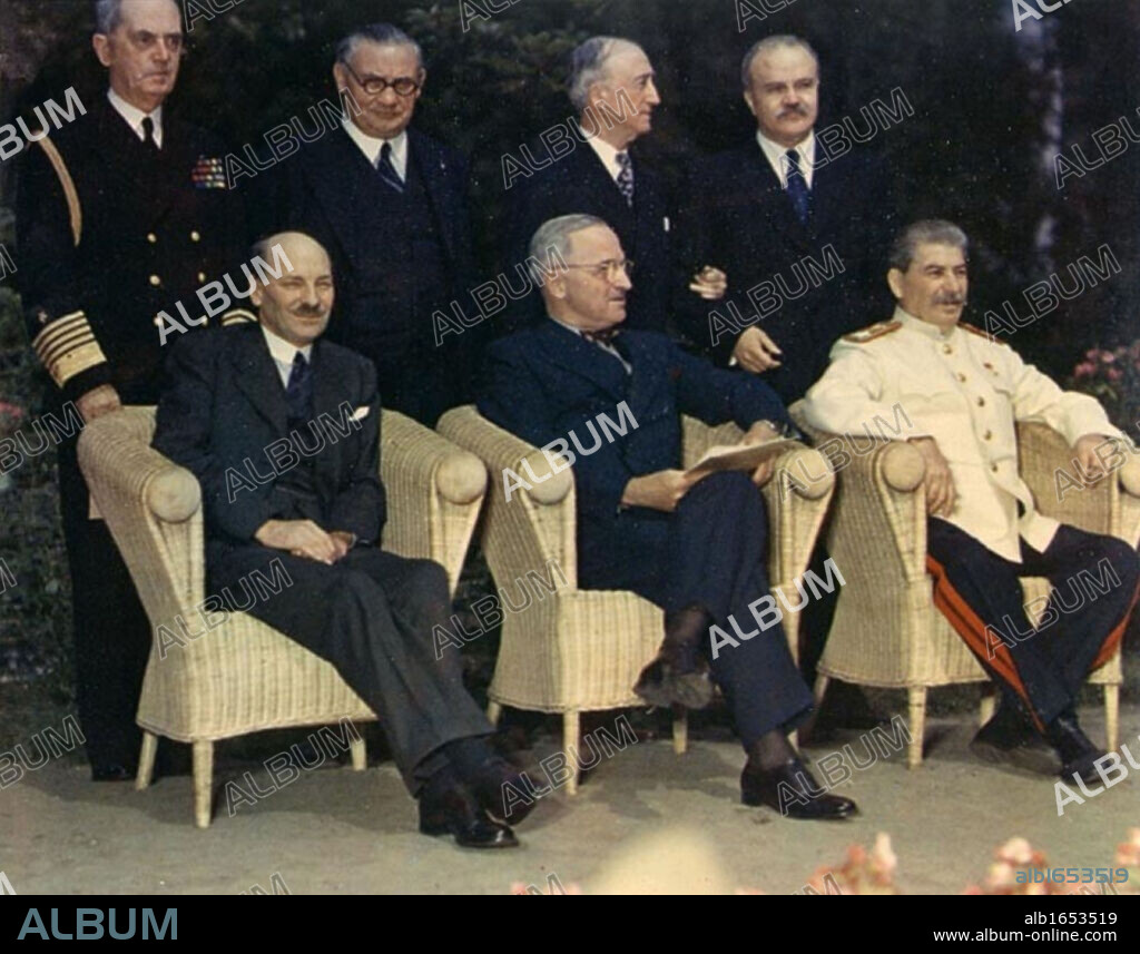 Clement Attlee, Harry Truman, and Joseph Stalin, seated outdoors at Potsdam Conference) 1945.