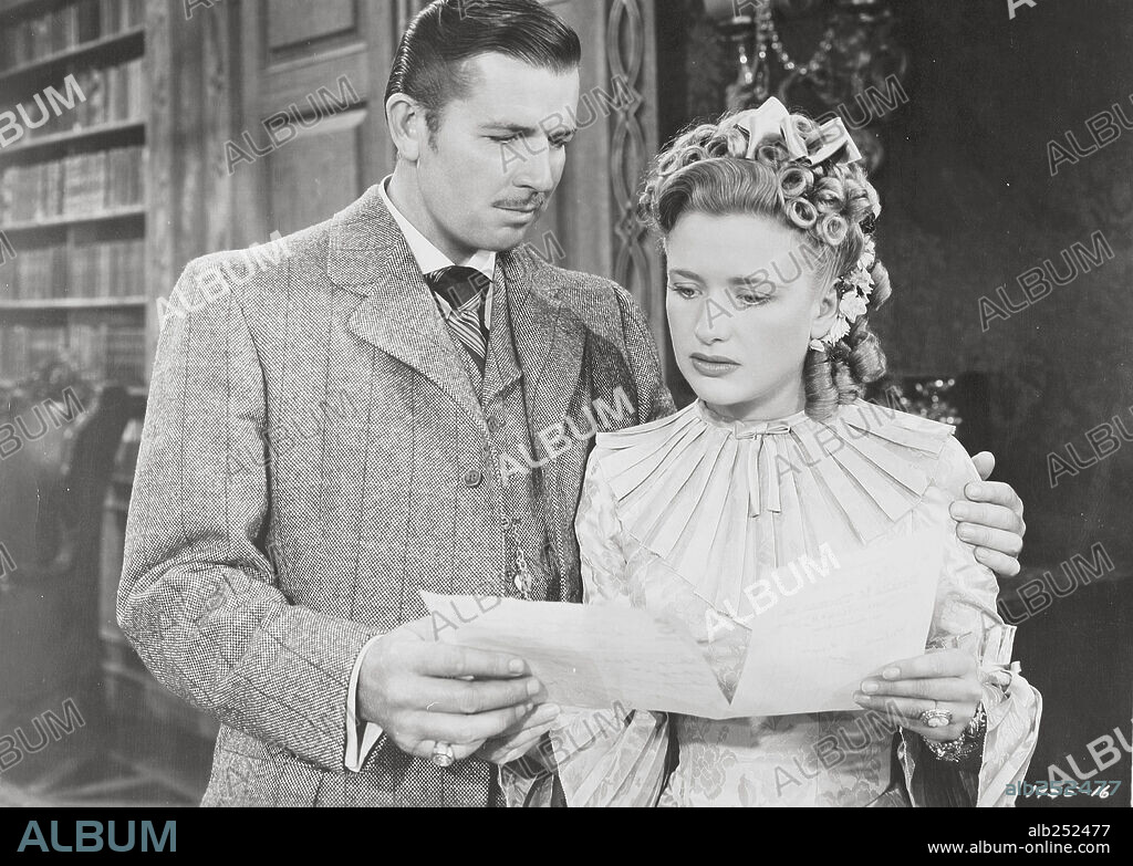 BRUCE CABOT and PRISCILLA LANE in SILVER QUEEN, 1942, directed by LLOYD BACON. Copyright UNITED ARTISTS.