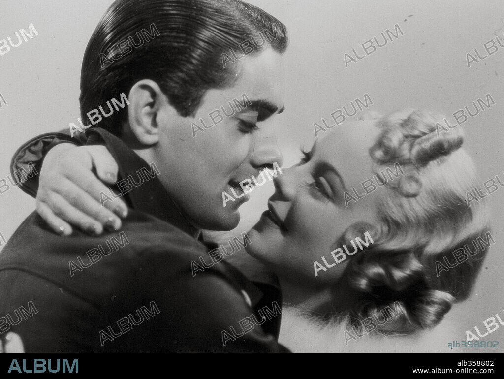 SONJA HENIE and TYRONE POWER in THIN ICE, 1937, directed by SIDNEY LANFIELD. Copyright 20TH CENTURY FOX.