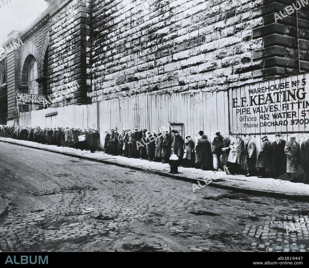 New York, New York. Bread line beside the Brooklyn Bridge approach during the the Great Depression between 1930 and 1935.