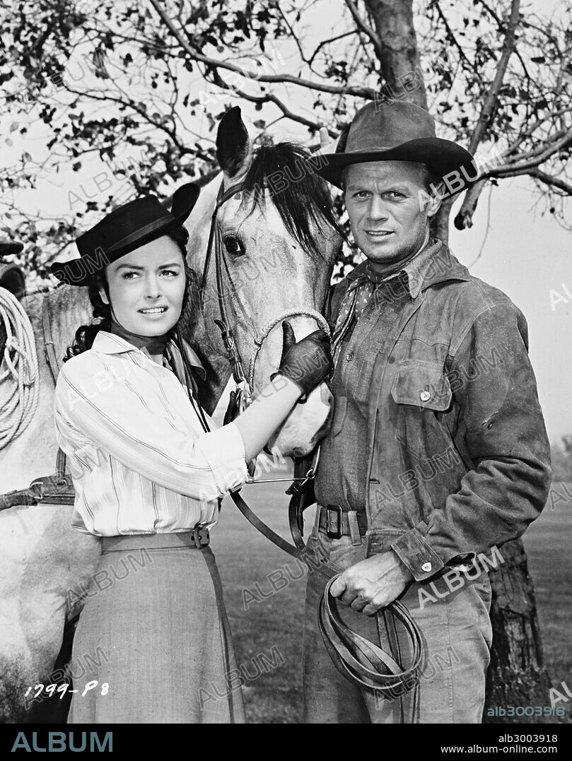 DONNA REED and RICHARD WIDMARK in BACKLASH, 1956, directed by JOHN STURGES. Copyright UNIVERSAL PICTURES.