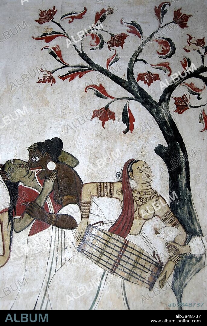 Buddhism, ancient wall painting, bare-breasted woman playing tabla drum, Mulgirigala Temple, Mulkirigala, Ceylon, Sri Lanka, South Asia, Asia.