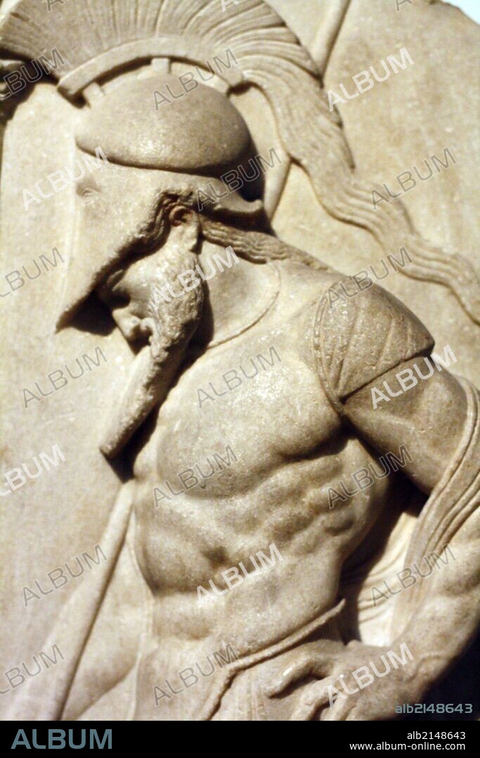 Greek warrior. Hellenistic, 1st century BC From Rhodes This marble grave relief shoes a warrior dressed in a cuirass and helmet leaning on his spear in front of a funerary stele. The serpent at the base symbolises the soul of the deceased. The relief is 'archaising' and imitates Greek sculpture of the mid 5th century BC. (Photo by: Universal History Archive/UIG via Getty Images).