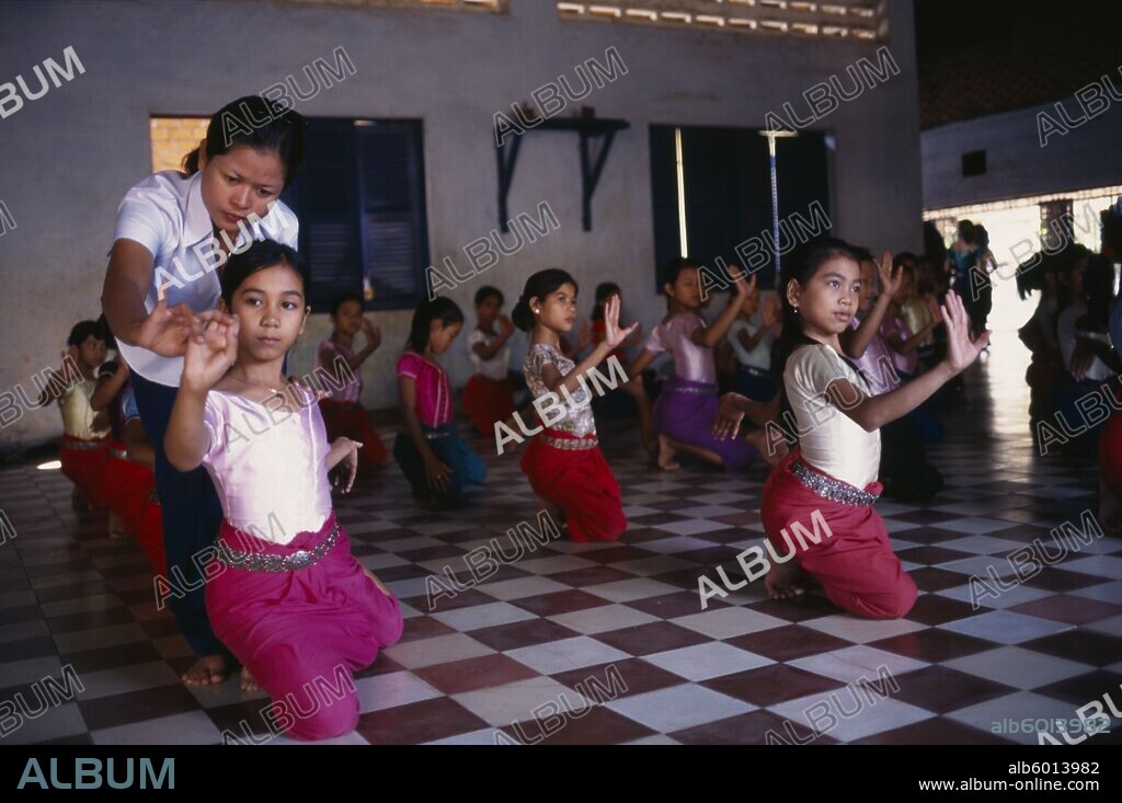 CAMBODIA Phnom Penh Teacher with ballet students at the Royal University of Fine Arts.