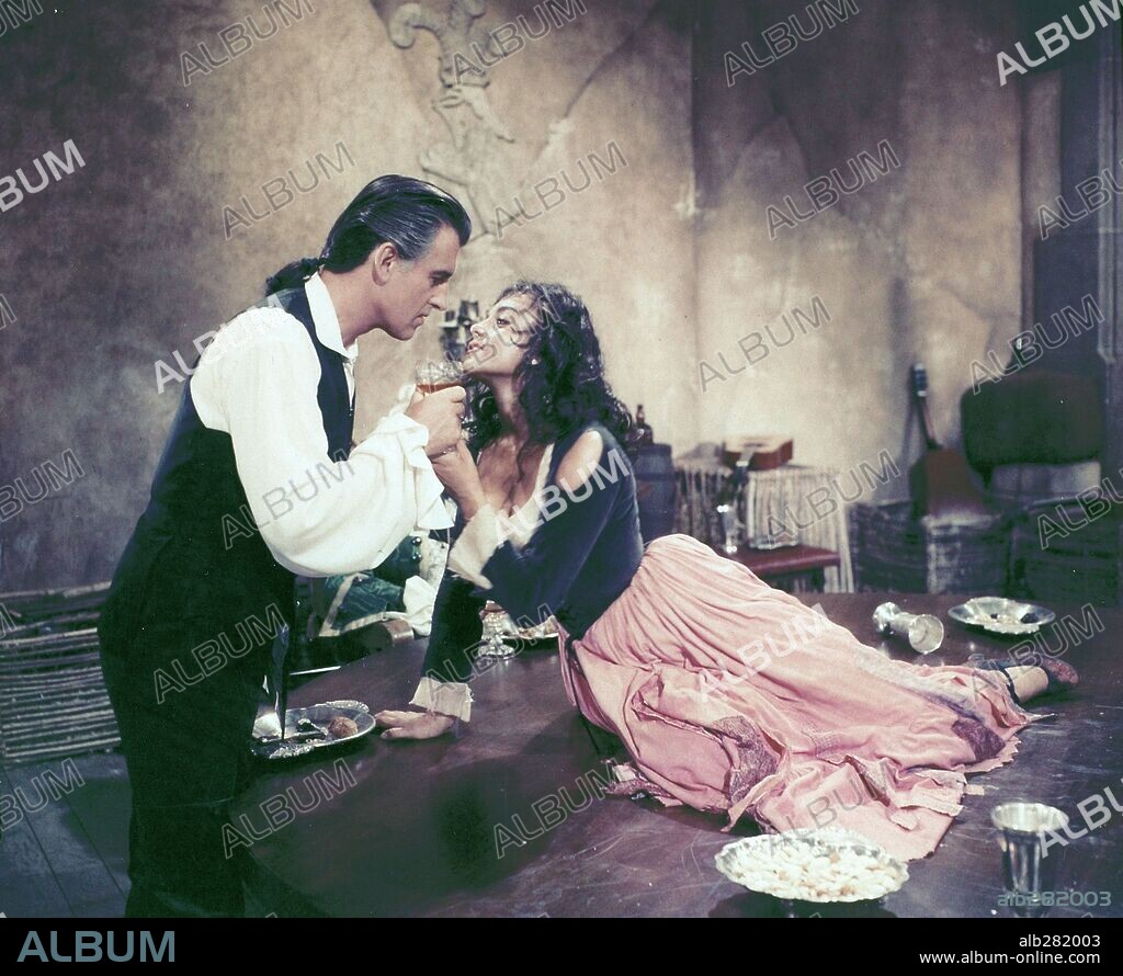 STEWART GRANGER and VIVECA LINDFORS in MOONFLEET, 1955, directed by FRITZ LANG. Copyright M.G.M.