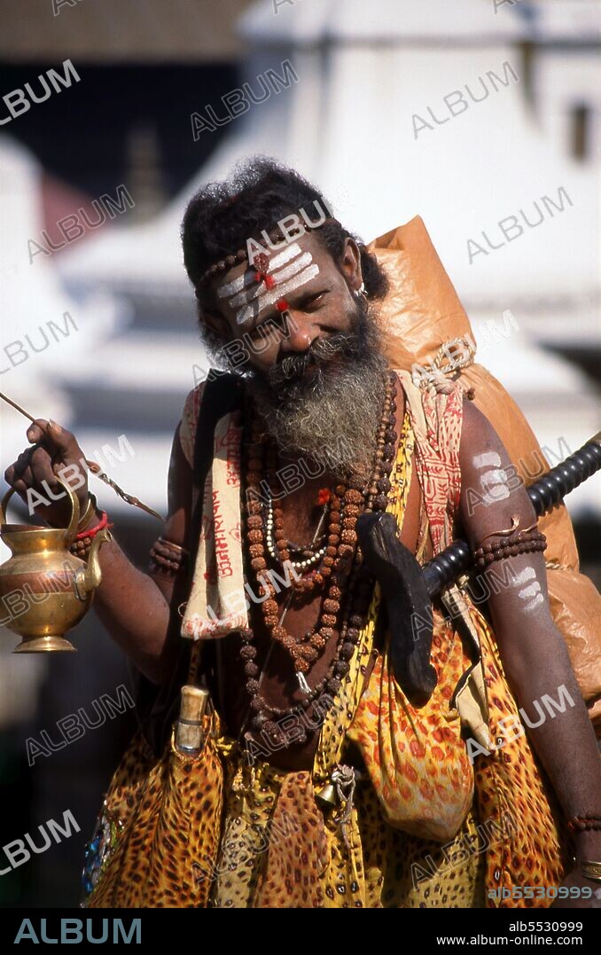 They are known, variously, as sadhus (saints, or 'good ones'), yogis (ascetic practitioners), fakirs (ascetic seeker after the Truth) and sannyasins (wandering mendicants and ascetics). They are the ascetic – and often eccentric – practitioners of an austere form of Hinduism. Sworn to cast off earthly desires, some choose to live as anchorites in the wilderness. Others are of a less retiring disposition, especially in the towns and temples of Nepal's Kathmandu Valley. If the Vale of Kathmandu seems to boast more than its share of sadhus and yogis, this is because of the number and importance of Hindu temples in the region. The most important temple of Vishnu in the valley is Changunarayan, and here the visitor will find many Vaishnavite ascetics. Likewise, the most important temple for followers of Shiva is the temple at Pashupatinath. Vishnu, also known as Narayan, can be identified by his four arms holding a sanka (sea shell), a chakra (round weapon), a gada (stick-like weapon) and a padma (lotus flower). The best-known incarnation of Vishnu is Krishna, and his animal is the mythical Garuda. Shiva is often represented by the lingam, or phallus, as a symbol of his creative side. His animal is the bull, Nandi, and his weapon is the trisul, or trident. According to Hindu mythology Shiva is supposed to live in the Himalayas and wears a garland of snakes. He is also said to smoke a lot of bhang, or hashish.