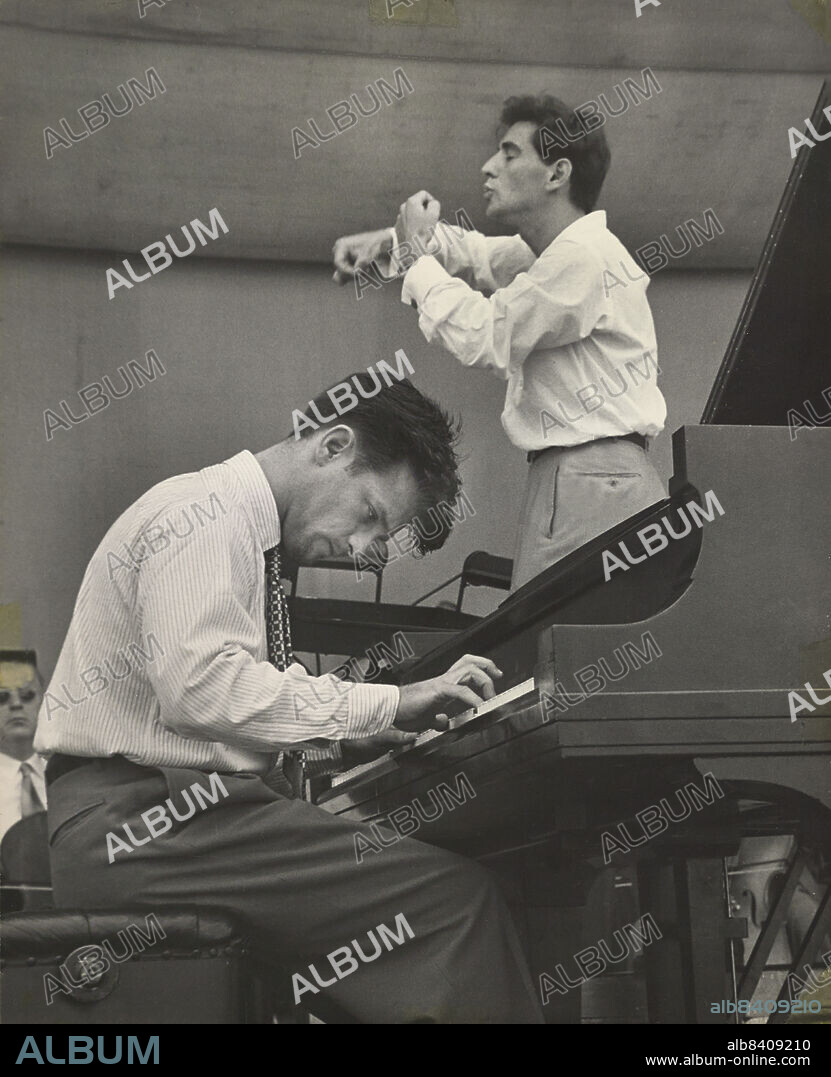 Conductor Leonard Bernstein rehearsing the New York Philharmonic with Piano soloist William Kapell, Lewisohn Stadium, New York City, New York, USA, Unidentified Artist, June 1947.