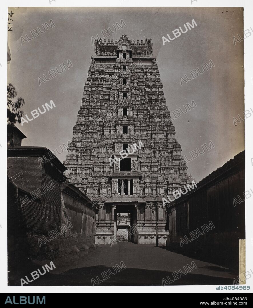 NICHOLAS AND COMPANY. East face of the gopura at the entrance to fourth court of the Ranganatha Temple, Srirangam. A general view looking along the street towards the gopura. Archaeological Survey of India Collections: Indian Museum Series (Duplicates). c. 1884. Photograph. Source: Photo 1003/(2465).