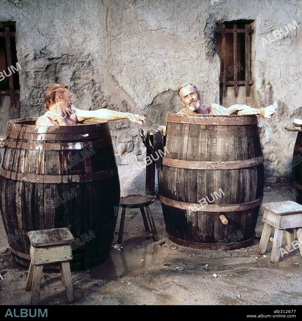 HENRY FONDA and KIRK DOUGLAS in THERE WAS A CROOKED MAN, 1970, directed by JOSEPH L. MANKIEWICZ. Copyright WARNER BROS/SEVEN ARTS.