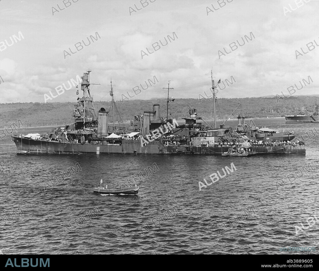 November 30, 1942 - USS Pensacola (CA-24) alongside USS Vestal (AR-4), undergoing repair of torpedo damage received during the Battle of Tassafaronga, off Guadalcanal. Note the hole in her side below the main mast, and the extensive fire damage in the area of that mast and the number three eight-inch gun turret.
