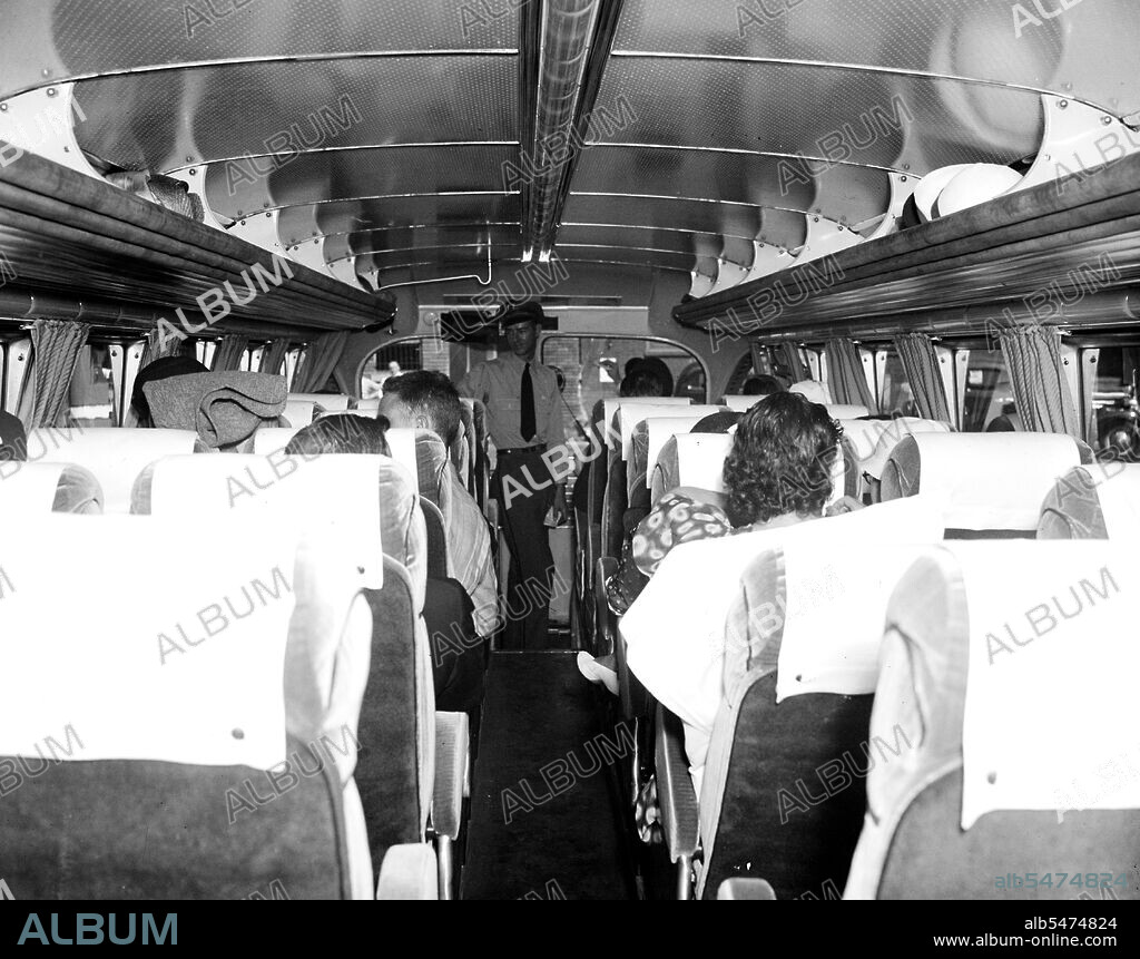 Bus passengers inside a Greyhound bus circa 1937.