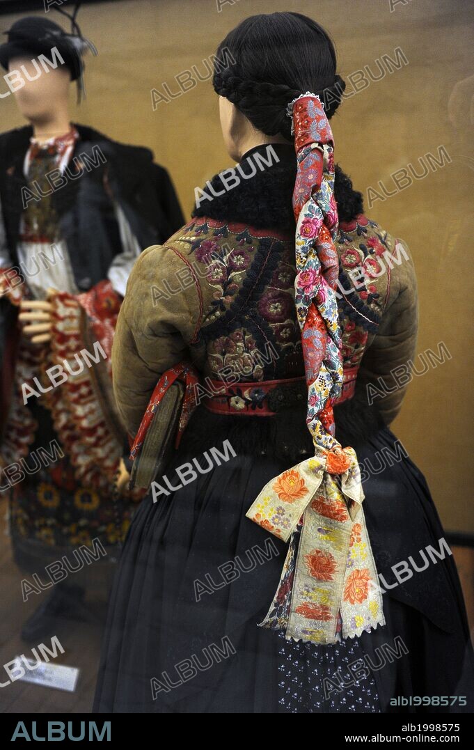 Young girl in festive winter church clothes. 1870. From Paloc Nogradmarcal, Nograd. Ethnographic Museum. Budapest. Hungary.