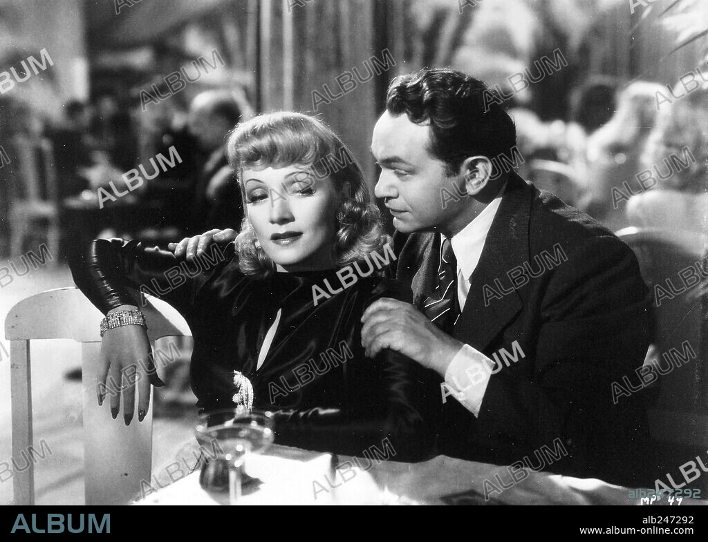 EDWARD G. ROBINSON and MARLENE DIETRICH in MANPOWER, 1941, directed by RAOUL WALSH. Copyright WARNER BROTHERS.