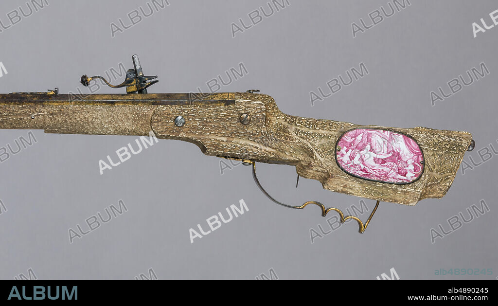 Martin Kammerer, Wheellock Rifle with Spanner, Shot Extracting Tool, and Shooting Patch, German, Augsburg, ca. 1665, Augsburg, German, Augsburg, Steel, iron, gold, wood, antler, copper alloy, enamel, bone, textile, rifle (2015.446a): L. 43 1/2 in. (110.5 cm); L. of barrel 32 1/2 in. (82.6 cm); W. 8 1/4 in. (21 cm); D. 4 1/4 in. (10.8 cm); Wt. 9 lb. 7 oz. (4280.8 g); spanner (2015.446b): L. 7 3/4 in. (19.7 cm); W. 7/8 in. (2.2 cm); D. 1 9/16 in. (4 cm); Wt. 4 oz. (113.4 g); shot extracting tool (2015.446c): L. 1 13/16 in. (4.6 cm); Diam. 3/8 in. (1 cm); Wt. 0.5 oz. (14.2 g); shooting patch (2015.446d): Diam. approx. 1 3/8 in. (3.5 cm), Firearms-Guns-Wheellock.