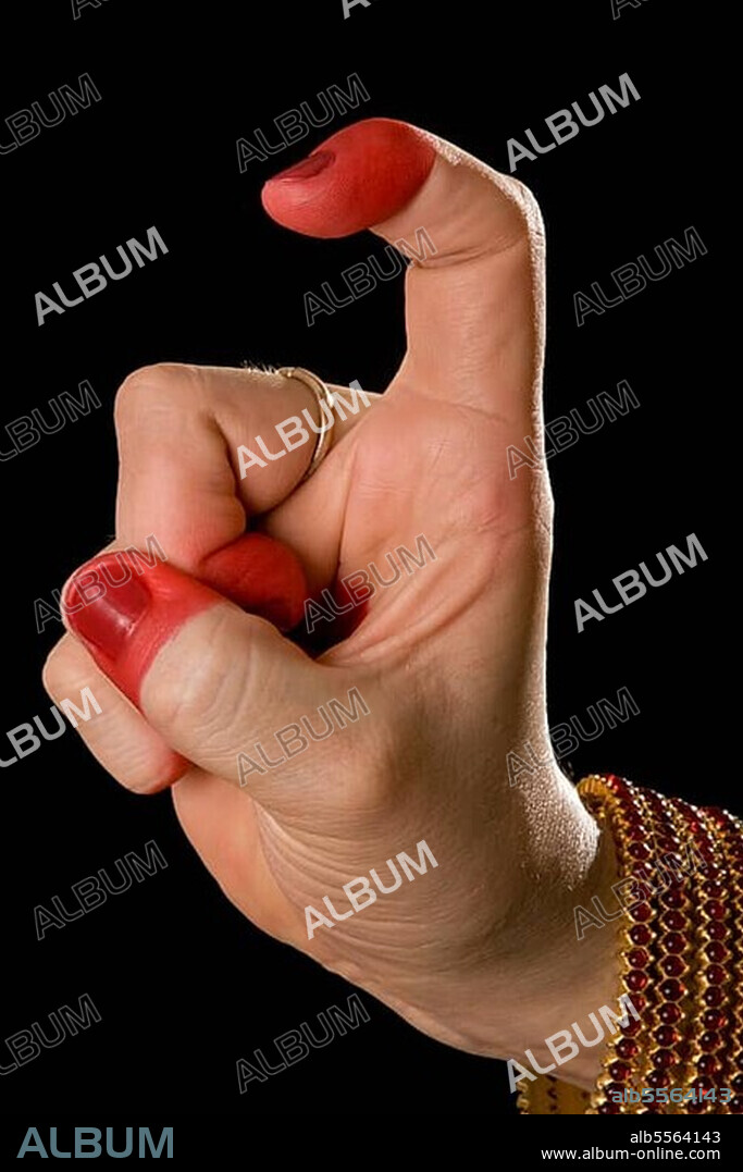 Woman hand showing Tamrachuda hasta (hand gesture) (also called mudra) (meaning "rooster") of indian classic dance Bharata Natyam. Also used in other indian classical dances Kuchipudi and Odissi